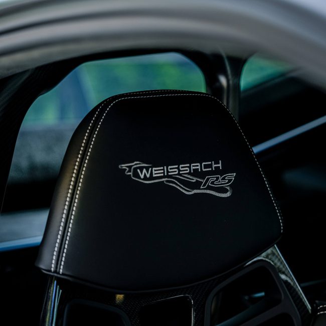 Black Sports Seat with White "WEISSACH RS" Embroidery, Luxurious Sports Car Interior