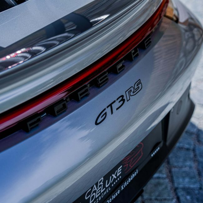 Rear of a Silver Porsche GT3 RS in Front of Car Deluxe Kitzbühel, Rent Luxury Sports Car